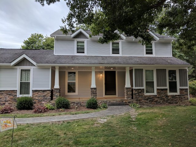 Front-porch views during the work and after the stone and column details came together.